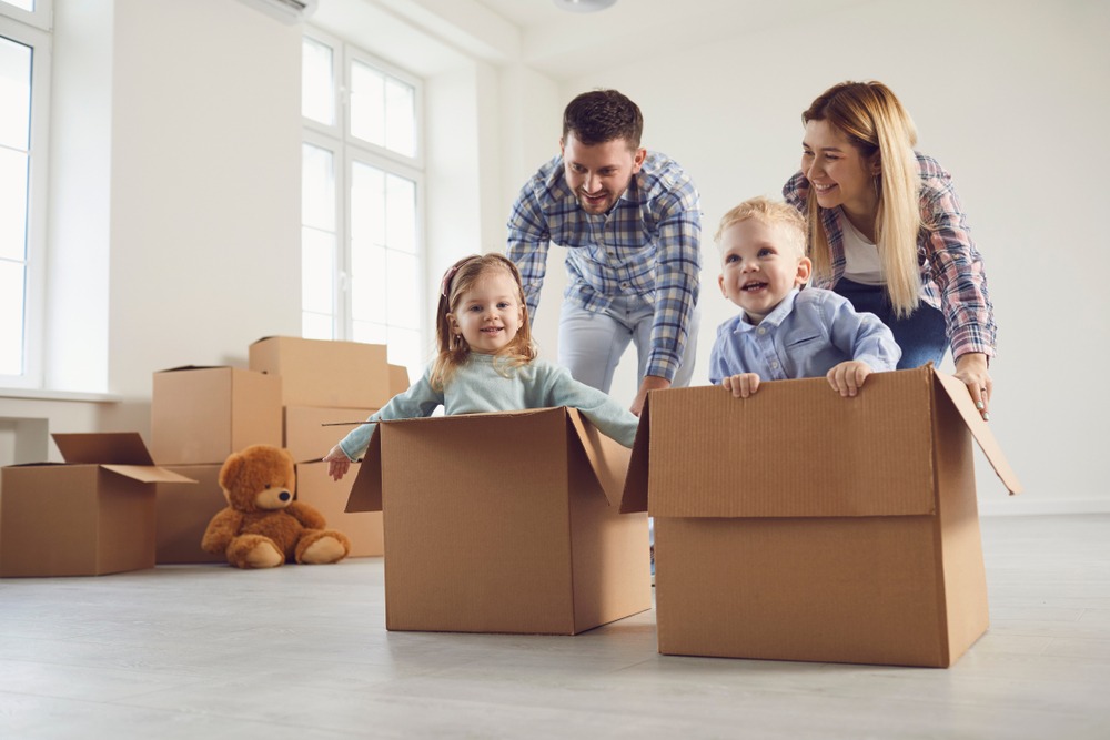 Happy family having fun in an new house